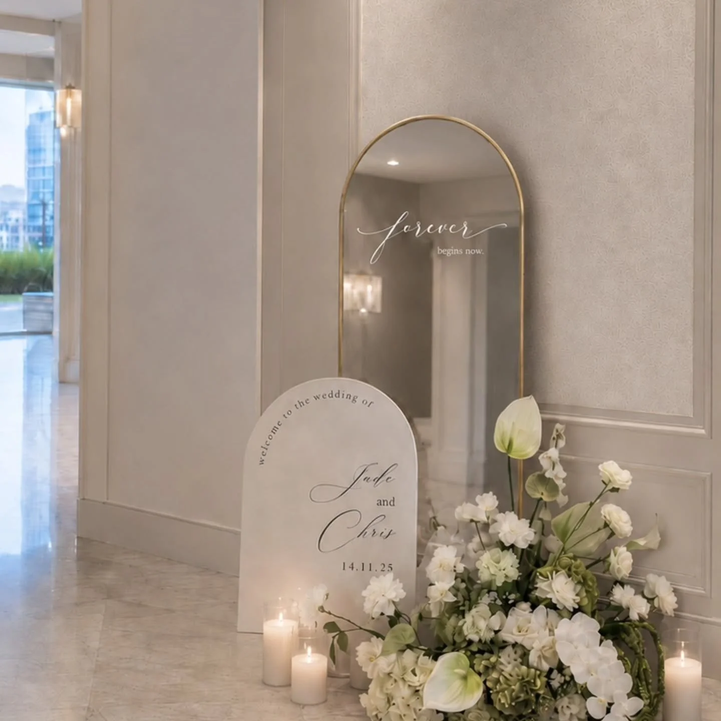 Elegant from every angle, and thoughtfully styled to welcome your guests into the celebration.

Featuring a minimalist arched sign paired with a gold mirror backdrop for a modern romantic aesthetic.

WelcomeSign WeddingWelcomeSign WeddingEntranceDeco