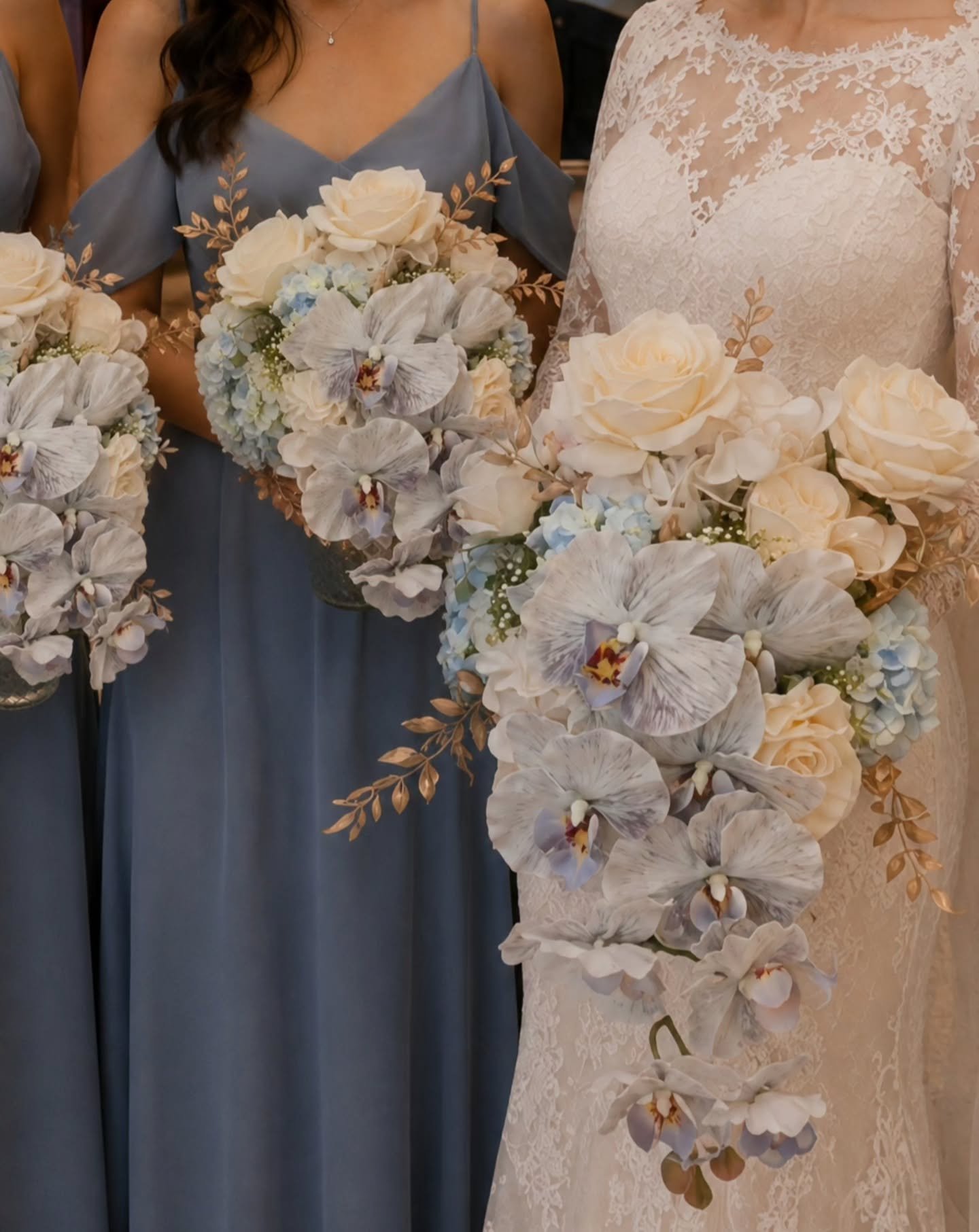 Soft blue, ivory and champagne tones come together in this romantic bridal bouquet collection. 🤍🩵 Featuring elegant orchids, roses and delicate gold foliage for a timeless, luxurious finish.

✨ Premium artificial bridal florals designed to last bey