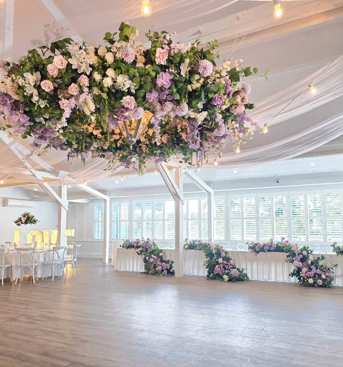 A lilac dream at @bramleighestate 💜
N&amp;D's Wedding @natskixx

Soft lilac ceiling draping and a lush statement floral chandelier, coming together in perfect harmony. ✨💜 
📍 @bramleighestate
#AngelsFloralEvent #BramleighEstate #LilacWedding #Weddi