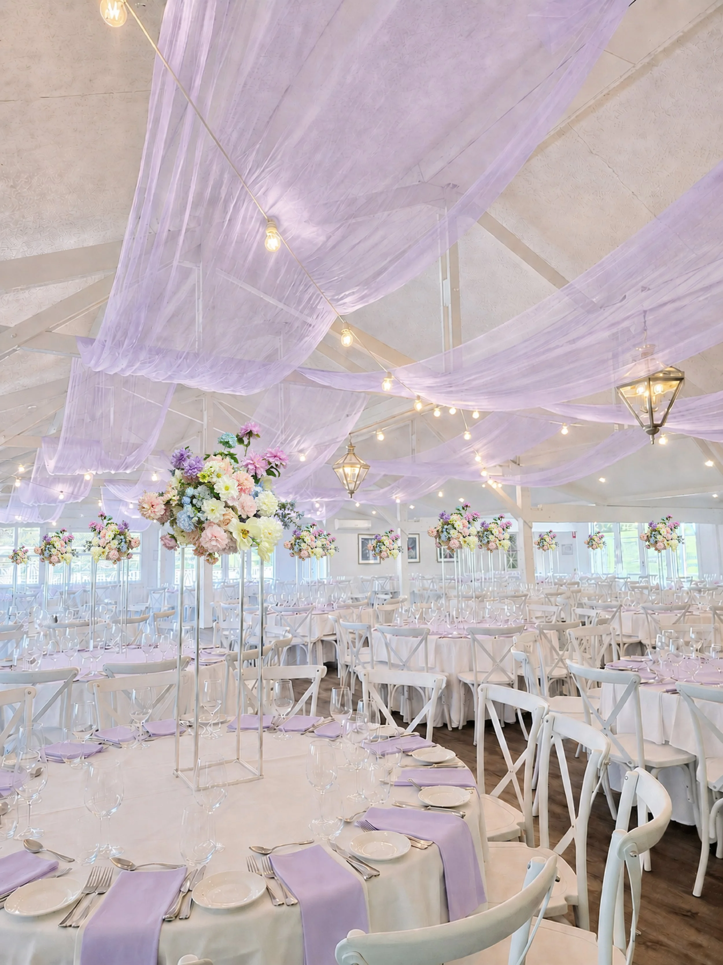 Lilac centrepiece with lilac sheer drape.jpg