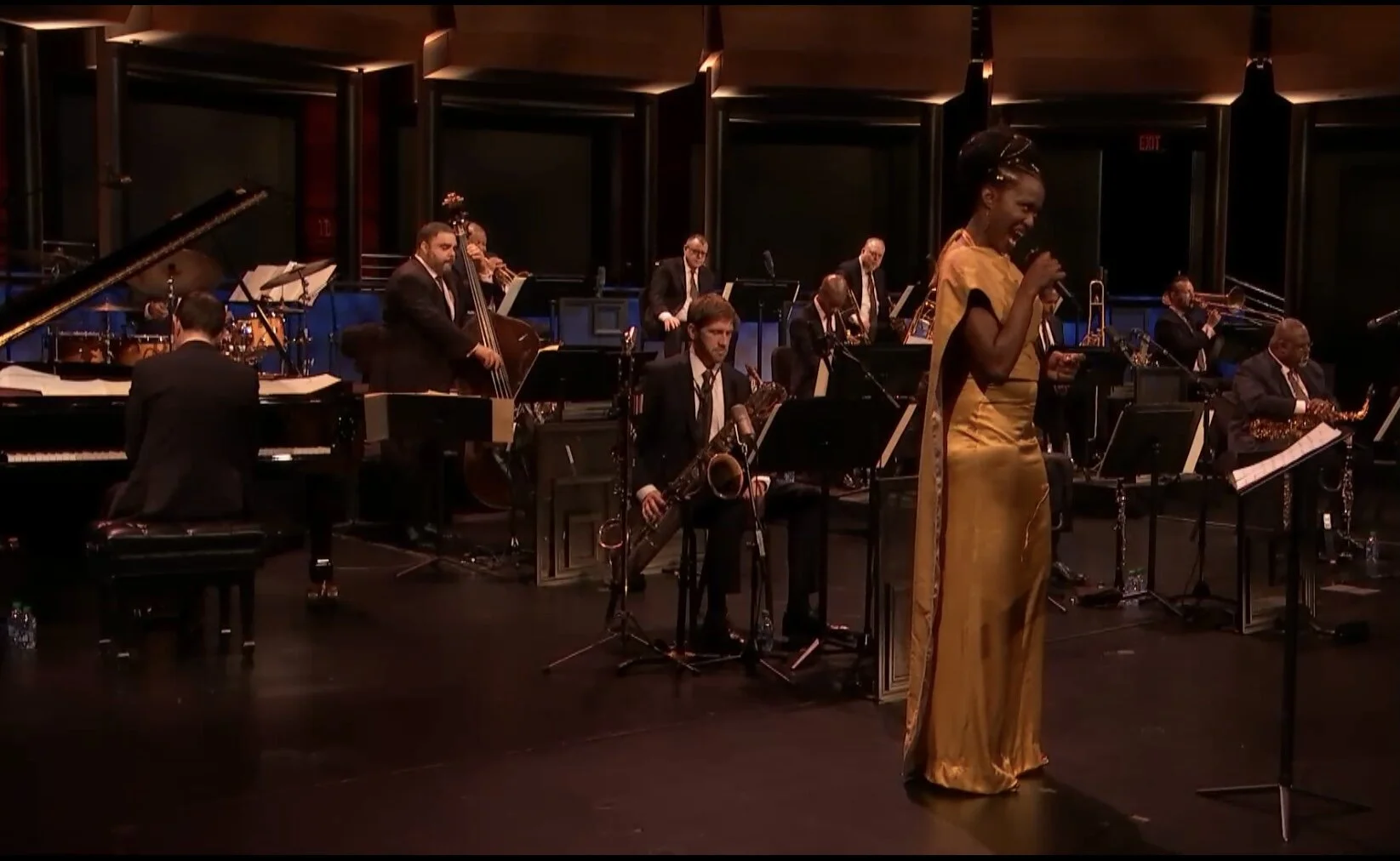 Shenel Johns in cape and dress