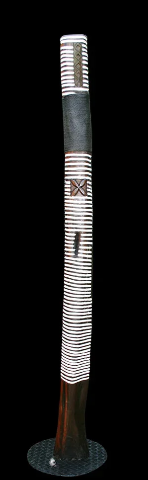 Large vertical sculpture entitled Family Tree