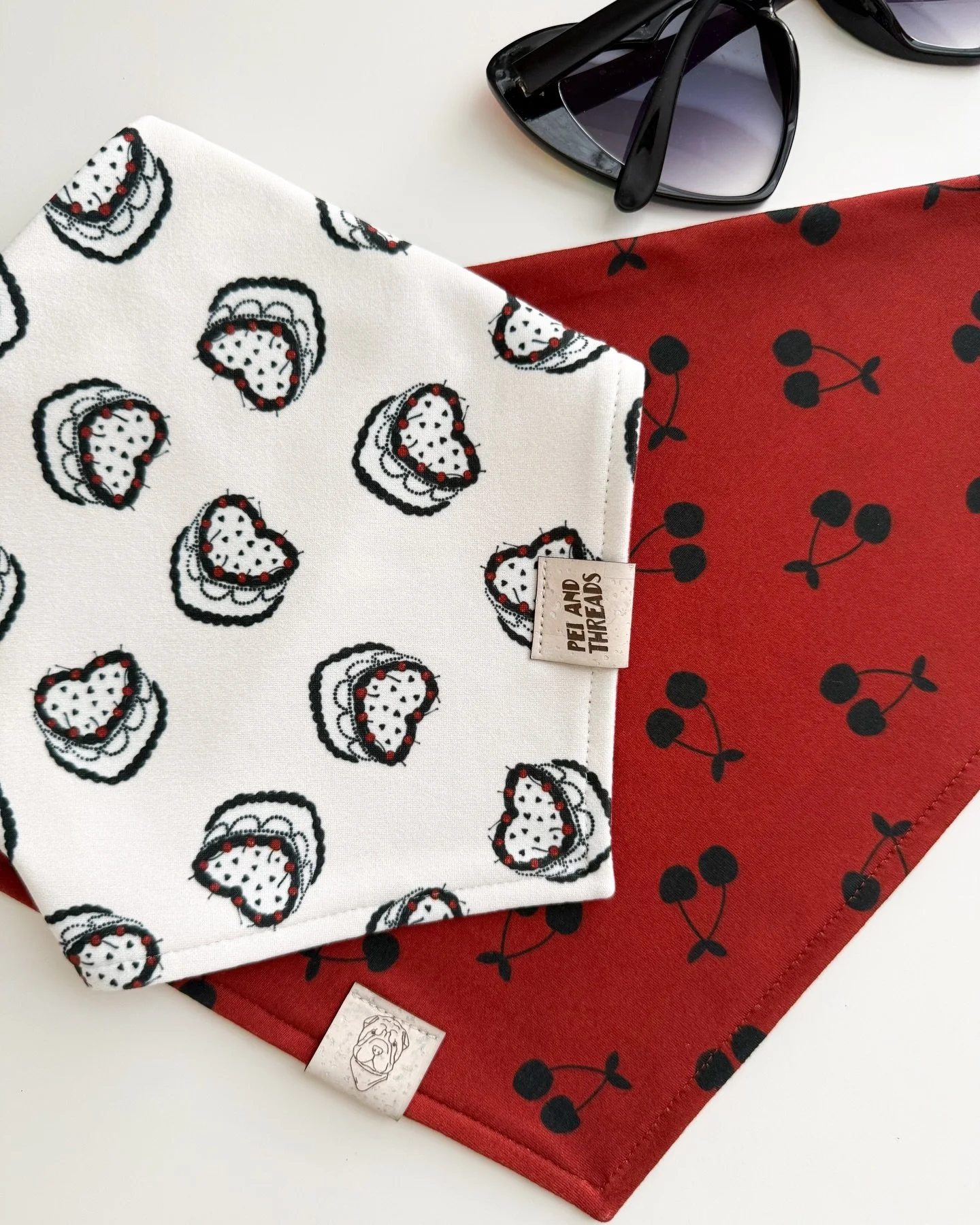 Meet Cherry on Top 🍒 She&rsquo;s giving retro, playful, and a little pin-up bakery 🖤

Made with so much love in our buttery soft fabric.
This reversible bandana and four other designs will be dropping Saturday 1/24. 

If you want to be the first to