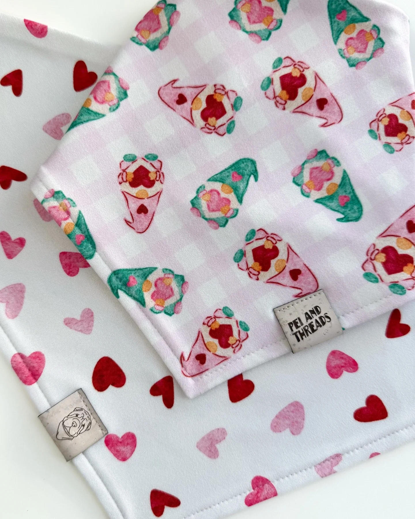 Meet Love Gnomes, a whimsical watercolor design filled with cozy charm and sweet little details for the hopeless romantics 💖

Made with so much love in our buttery soft fabric.
This reversible bandana and four other designs will be dropping Saturday