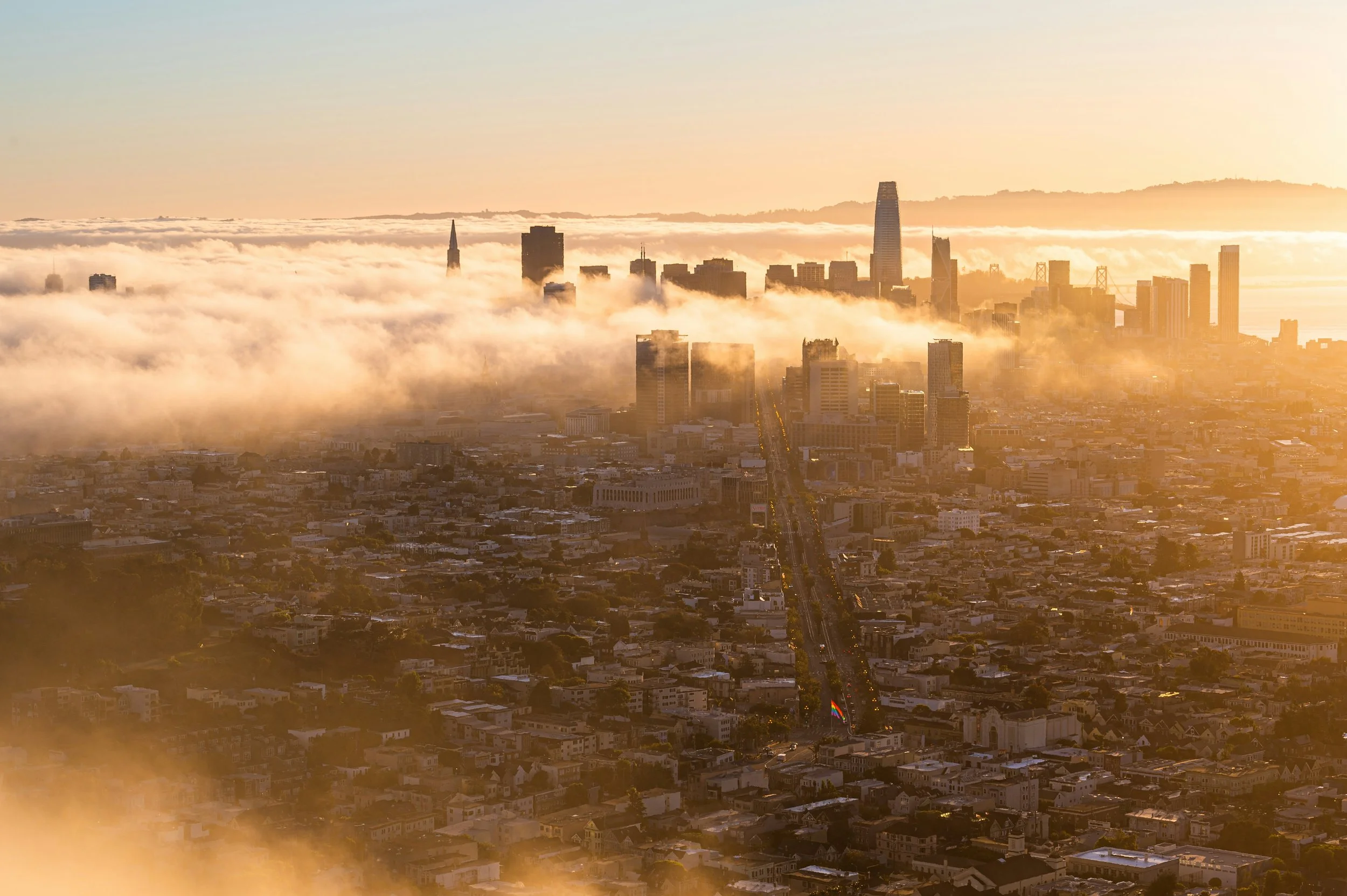 Fog rolling over San Francisco's hills at sunset