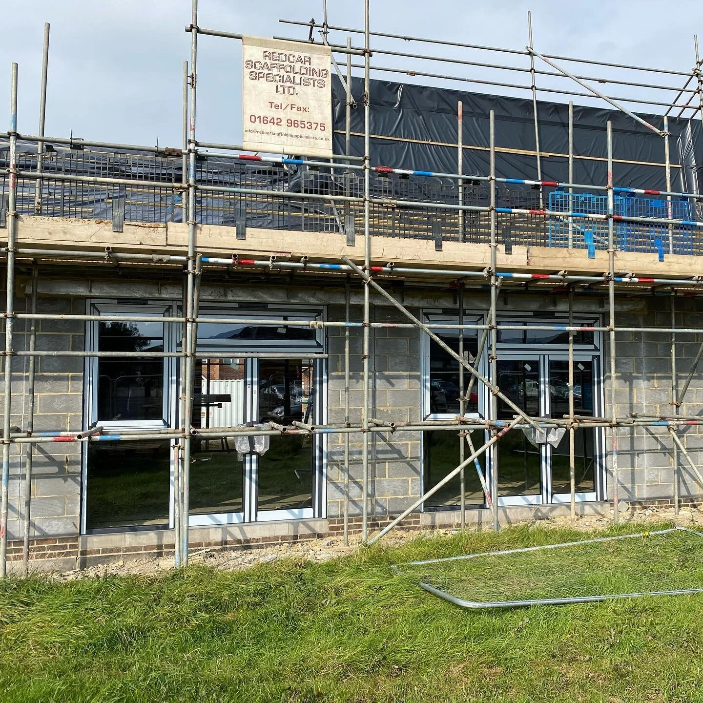 Doors in the hall have been added this week, as well as a temporary roof covering to keep the building water tight whilst we wait for the final roof covering to arrive. One door opening has a temporary wooden door so that the builders can get in and