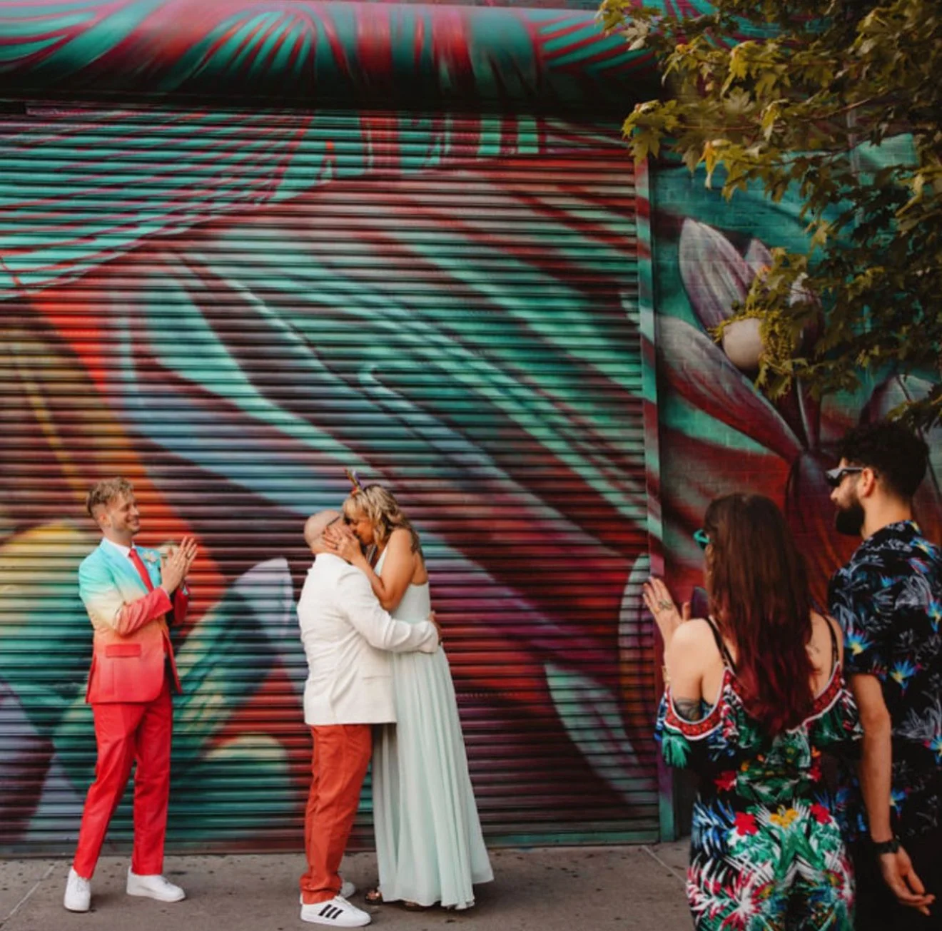 Couple eloping in Bushwick Brooklyn surrounded by street art murals — I Do Drive Thru NYC elopement