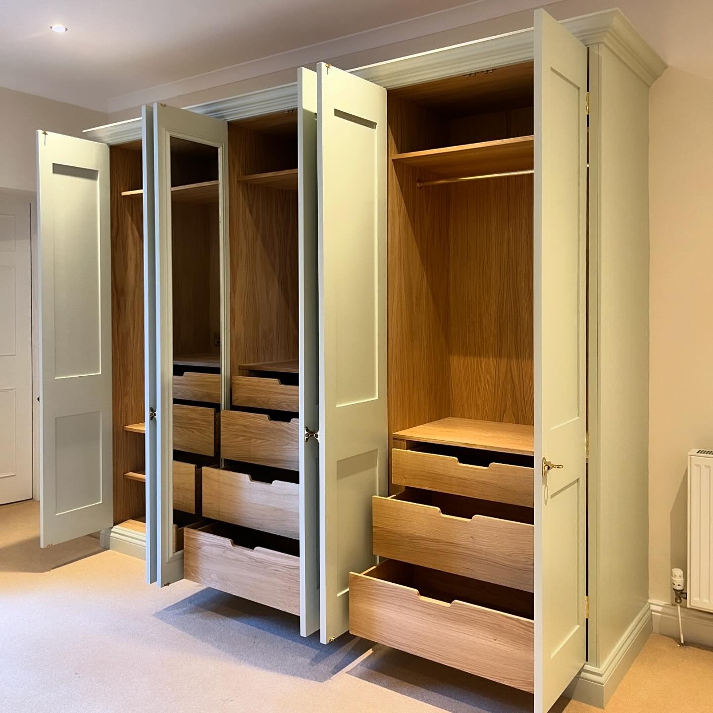 Inside is just as beautiful.  This generous wardrobe was designed to have plenty of drawers and shelves along with hanging space, and we also added automatic interior lighting and a full length mirror.  The paint colour is Farrow &amp; Ball&rsquo;s &