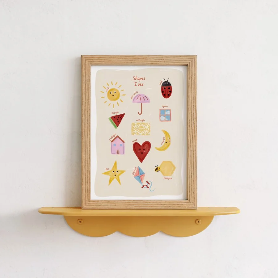 Shapes Nursery Print styled on wooden mustard yellow shelf on plain wall
