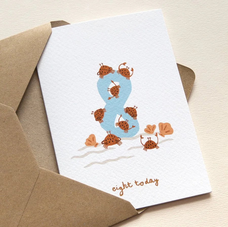 Crabs 8th Birthday Card in kraft envelope on angle
