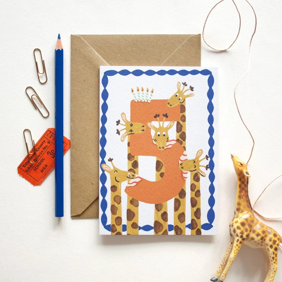 Giraffes 5th Birthday Card styled with toy giraffe