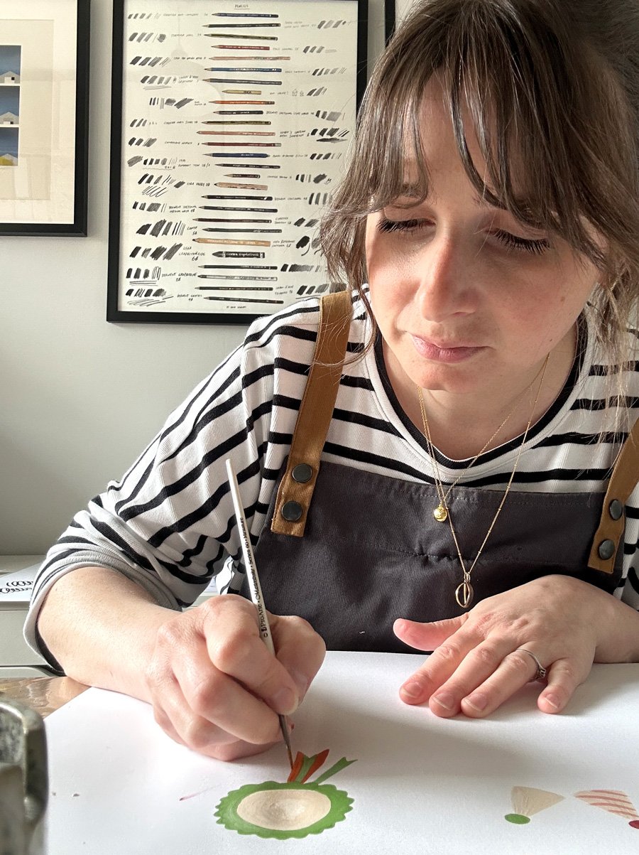Emma hand-painting nursery artwork