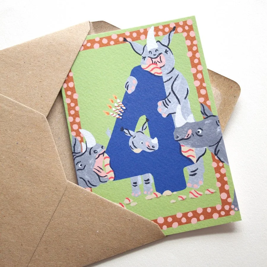 Rhinos 4th Birthday Card in kraft envelope on angle