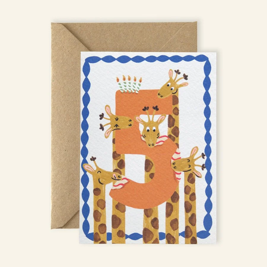 Giraffes 5th Birthday Card with kraft envelope on plain background