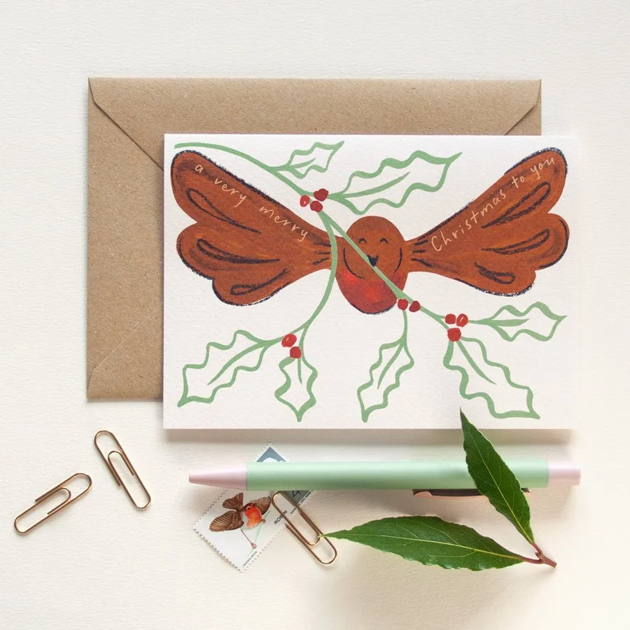 Robin Christmas Cards styled with pen, stamp and bay leaves