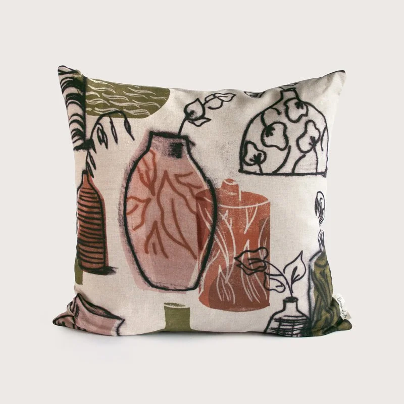 Still Life Vase Pink / Terracotta / Olive Green Fabric as a cushion on plain background
