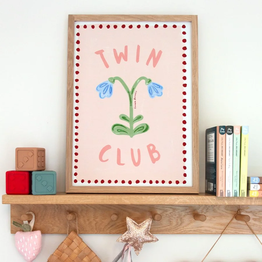 Twin Flower Print in pink, blue and burgundy styled on wooden peg shelf