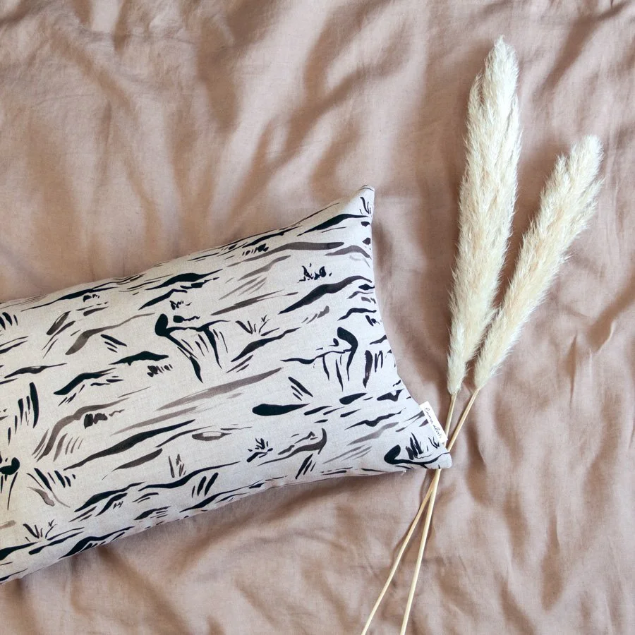 Abstract Landscape Fabric as a patterned cushion styled with pampas grass on linen