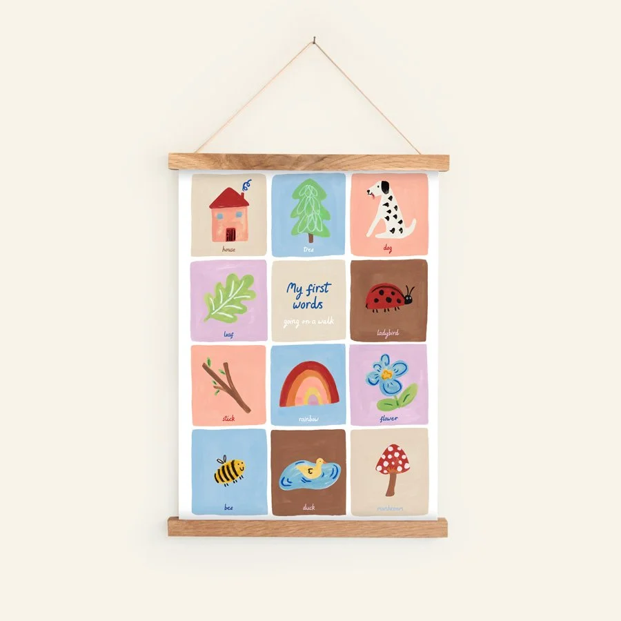 First Words Print - Educational Nursery Wall Art in hanging wooden frame on plain background