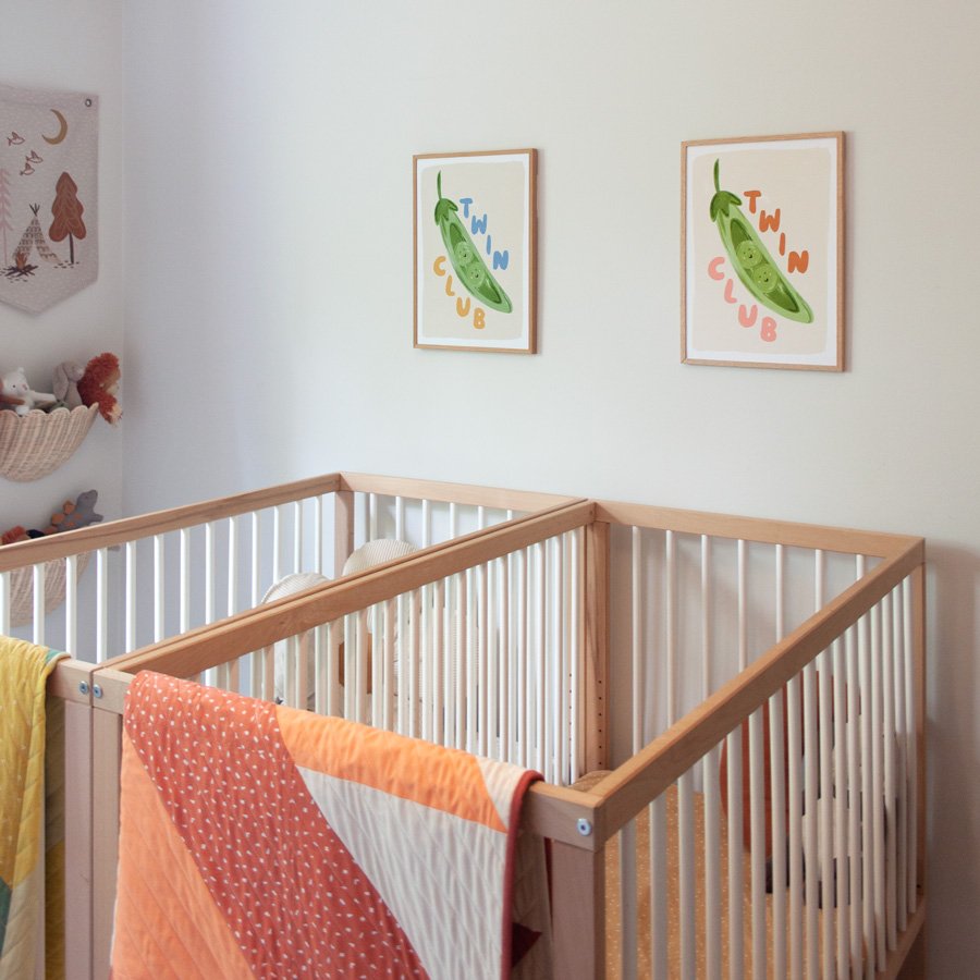 Peas in a Pod Twin Nursery Print Set styled in twin nursery above twin cots