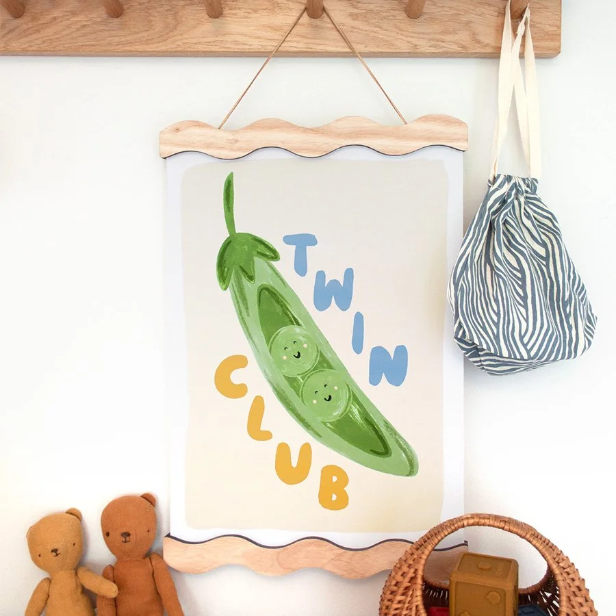Peas in a Pod Twin Nursery Print vintage blue and butter yellow styled on peg shelf
