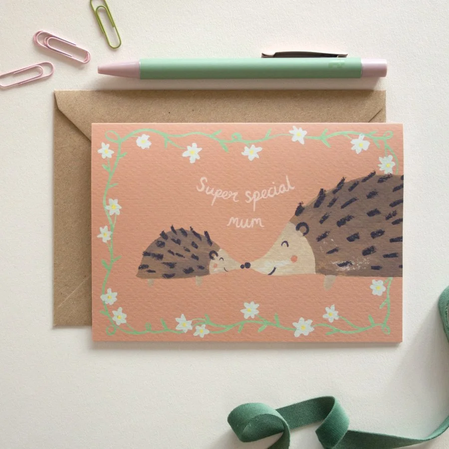 Hedgehog Mother's Day Card styled with paperclips, pen and ribbon