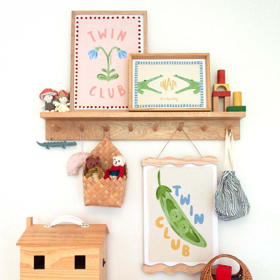 Peas in a Pod Twin Nursery Print styled on peg shelf with vintage colours