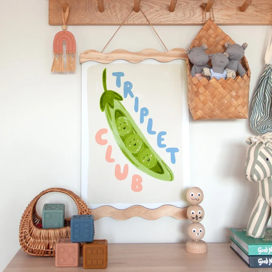 Little Em peas in a pod triplet nursery wall art print styled on peg shelf