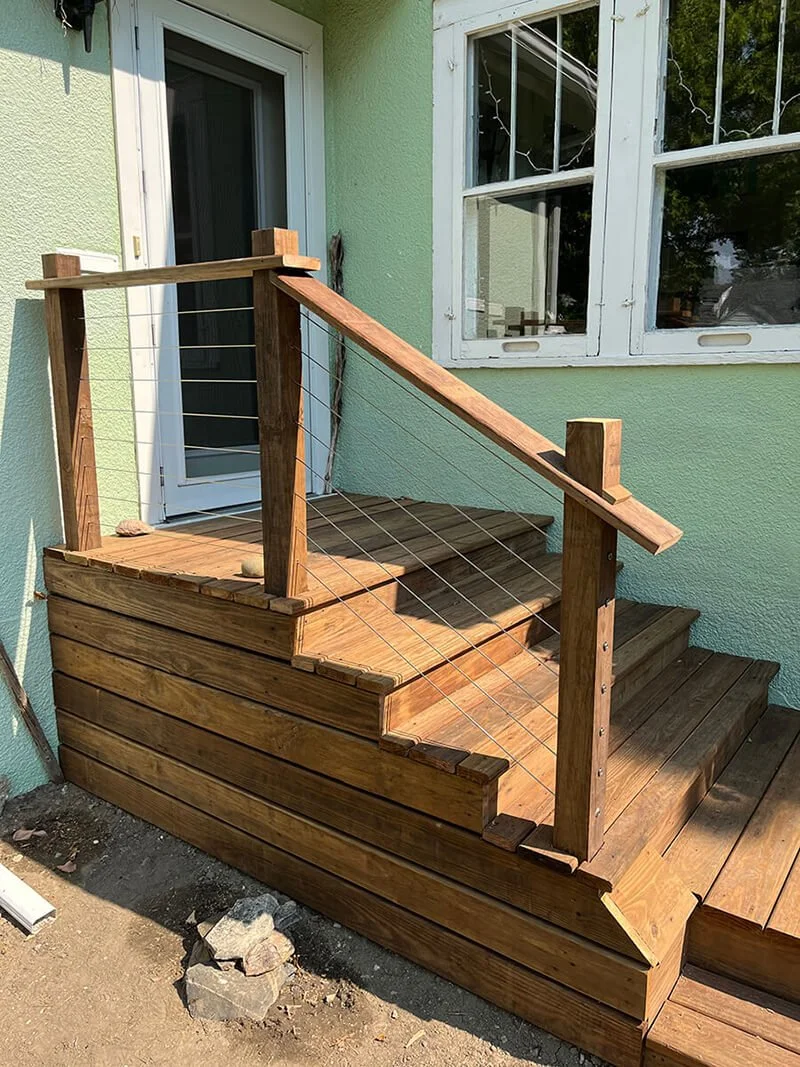 New pressure-treated deck with cable railing