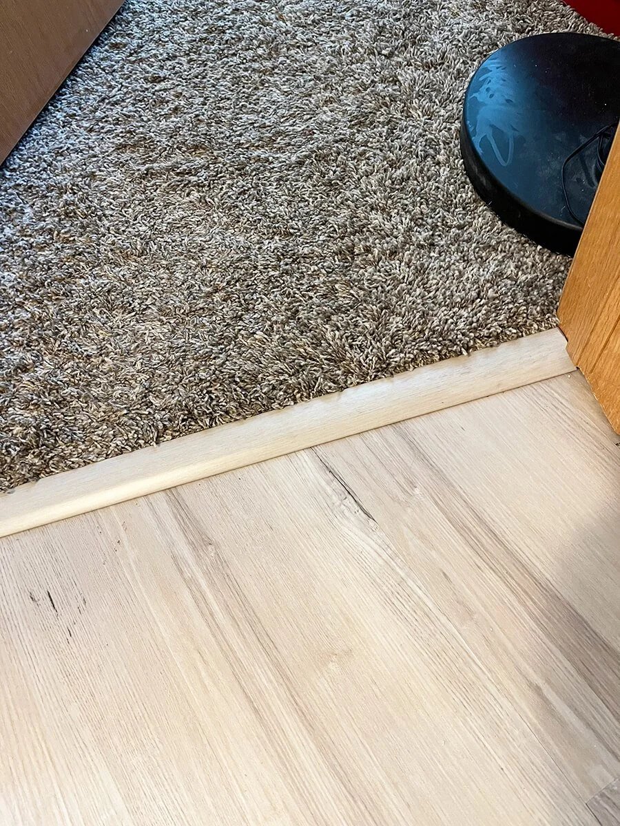 Bismarck vinyl plank flooring installation with transition to carpet