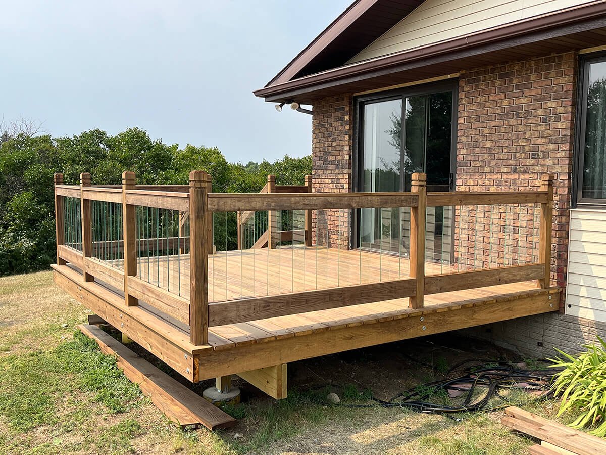 Glass balusters installed in Bismarck deck railing - viewed from east