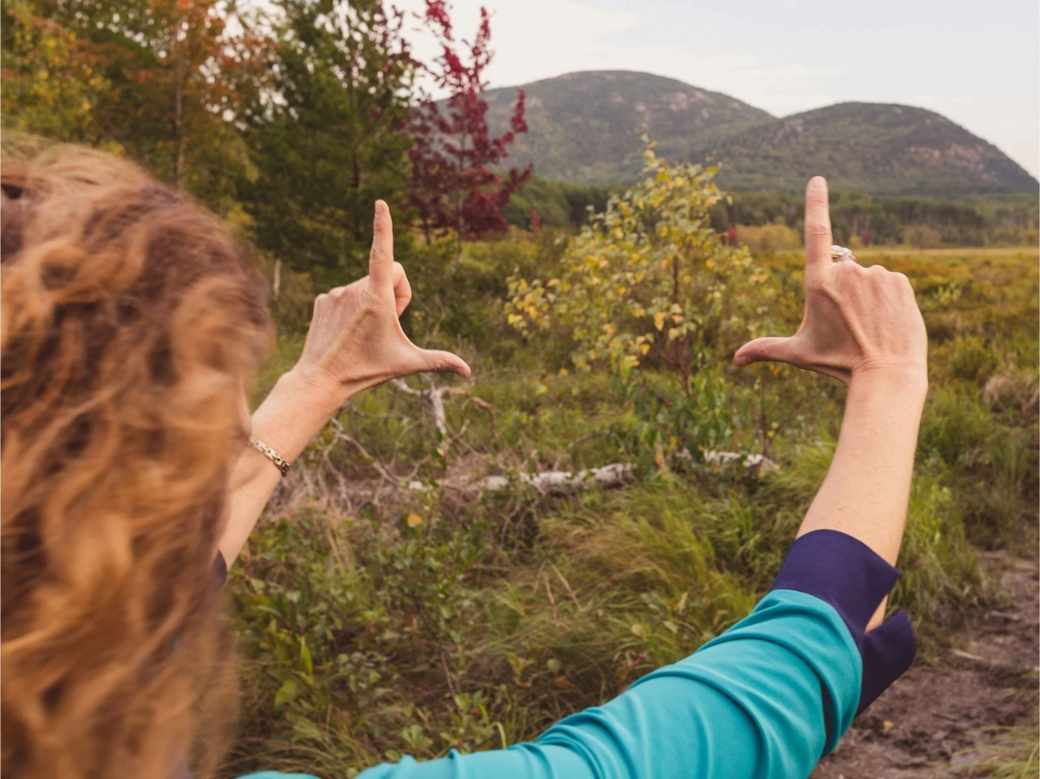Katie Dobies, creator of single artist stock site Stock Photo Queen frames a photograph showing vision and clarity.