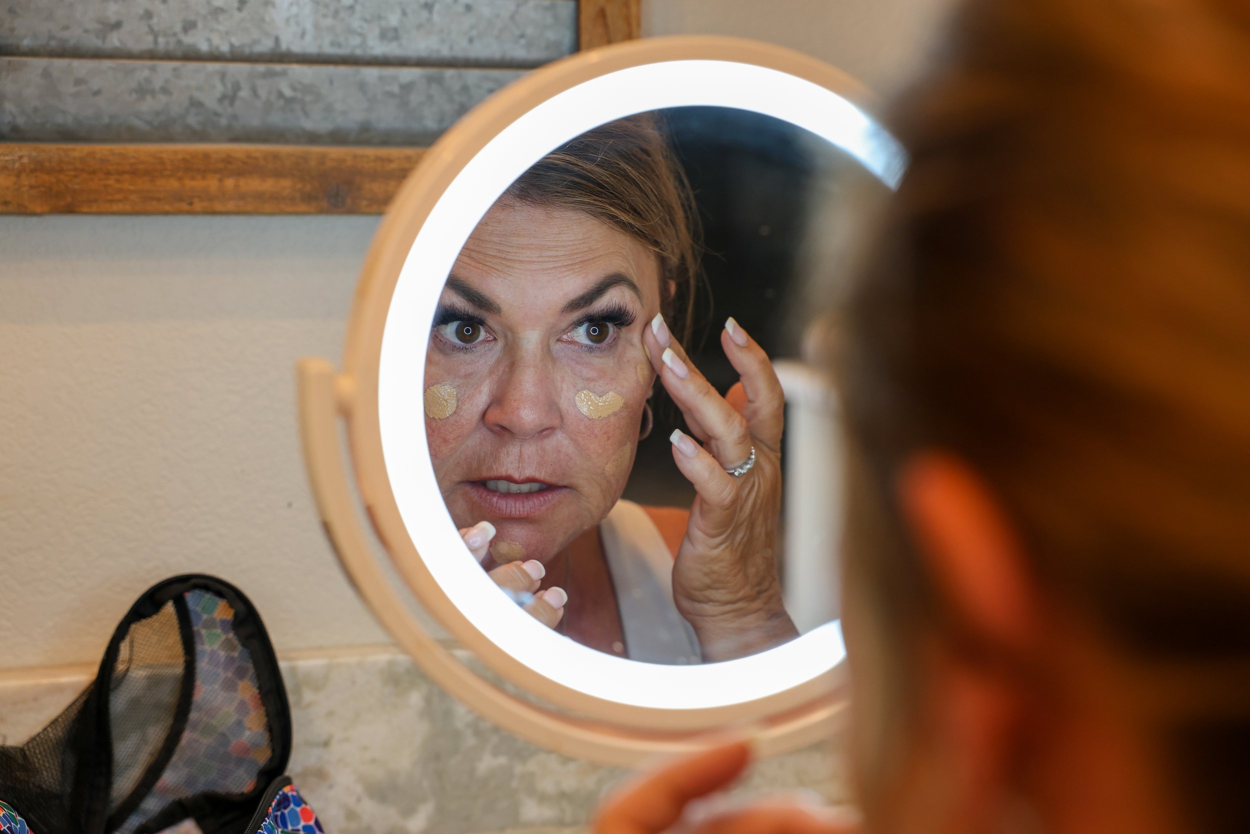 Tina gets ready at home for a busy day. Throughout the day, Brown took care of her grandchildren, went to the Brown Brothers Farm and built a float for the Delta Fair Parade.