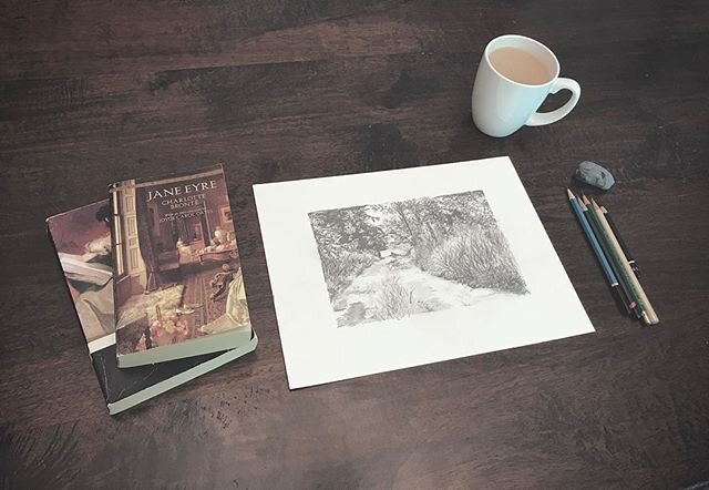 Taking pictures for the website I&rsquo;m trying to build. Realistic pictures like this one that say: &ldquo;I always have my favorite classic novels and a cup if coffee to spill on my drawings when I work.&rdquo;