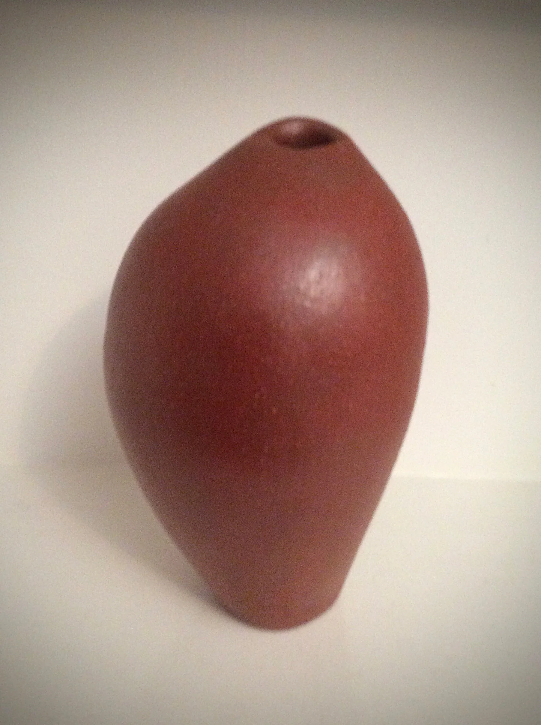 Terra cotta asymmetrical vessel. Redart terra sigillata surface