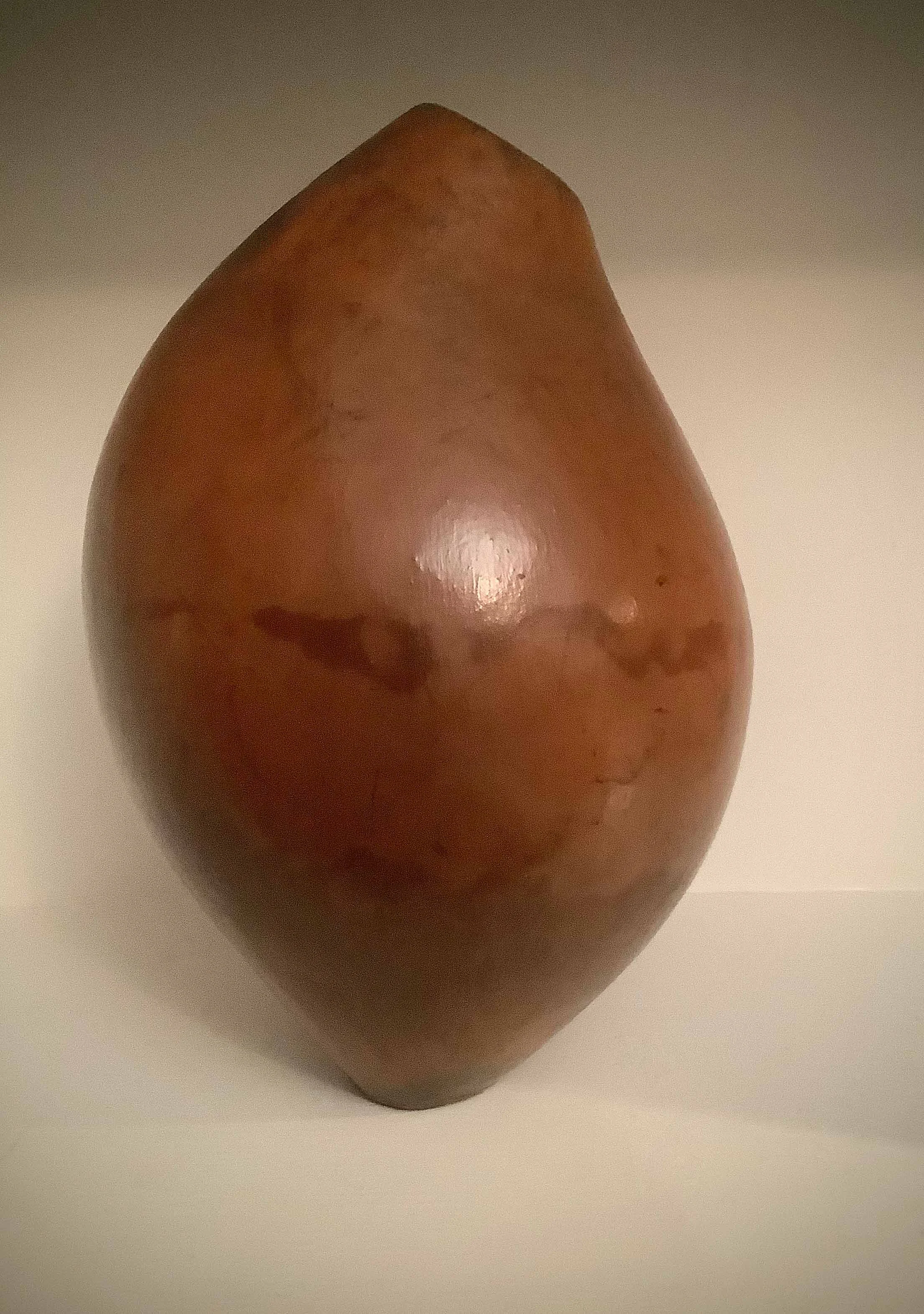 Large asymmetrical vessel. Redart terra sigillata over brown clay. Smoke fired.
