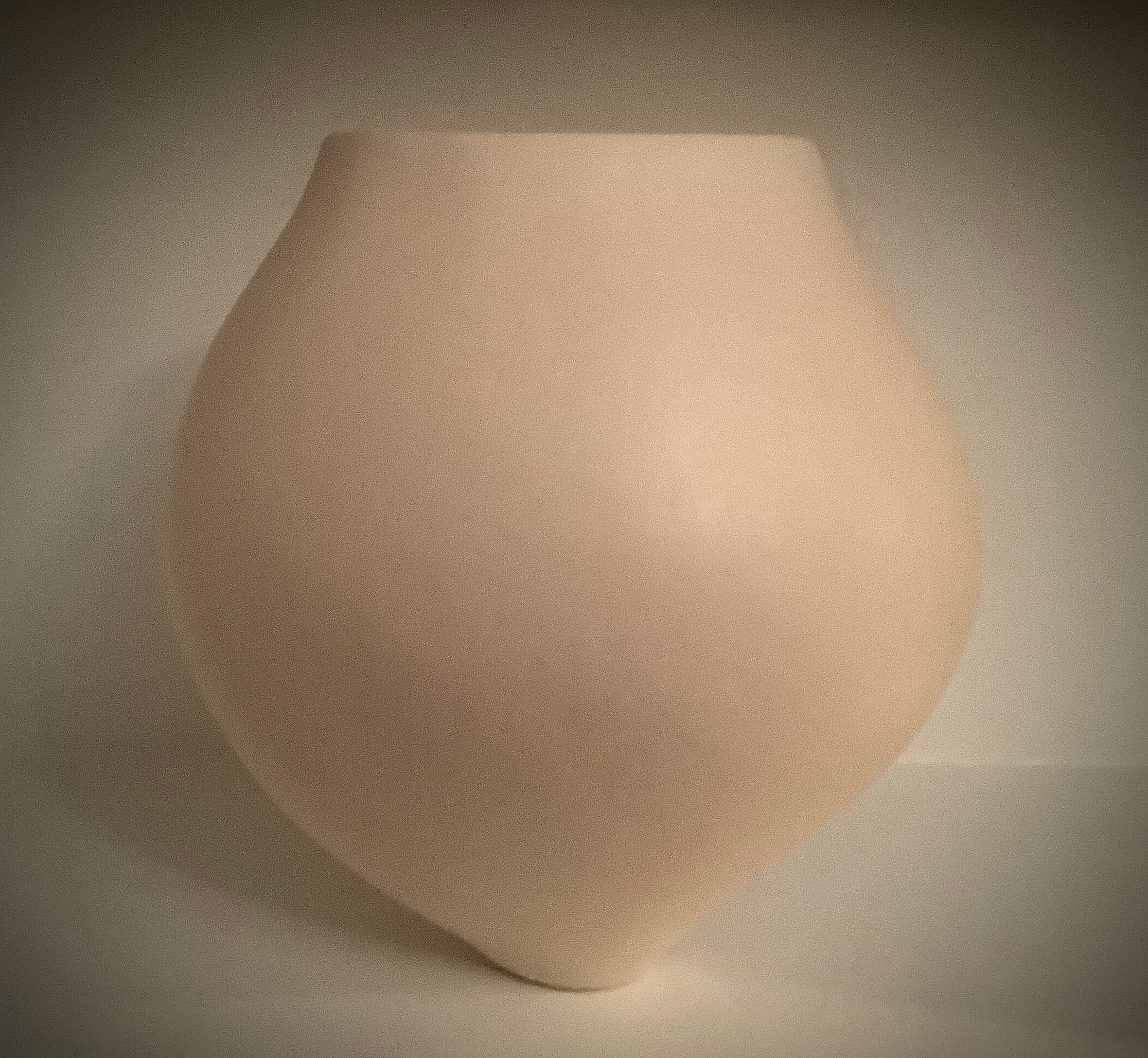White oval vessel. Terra sigillata surface.
