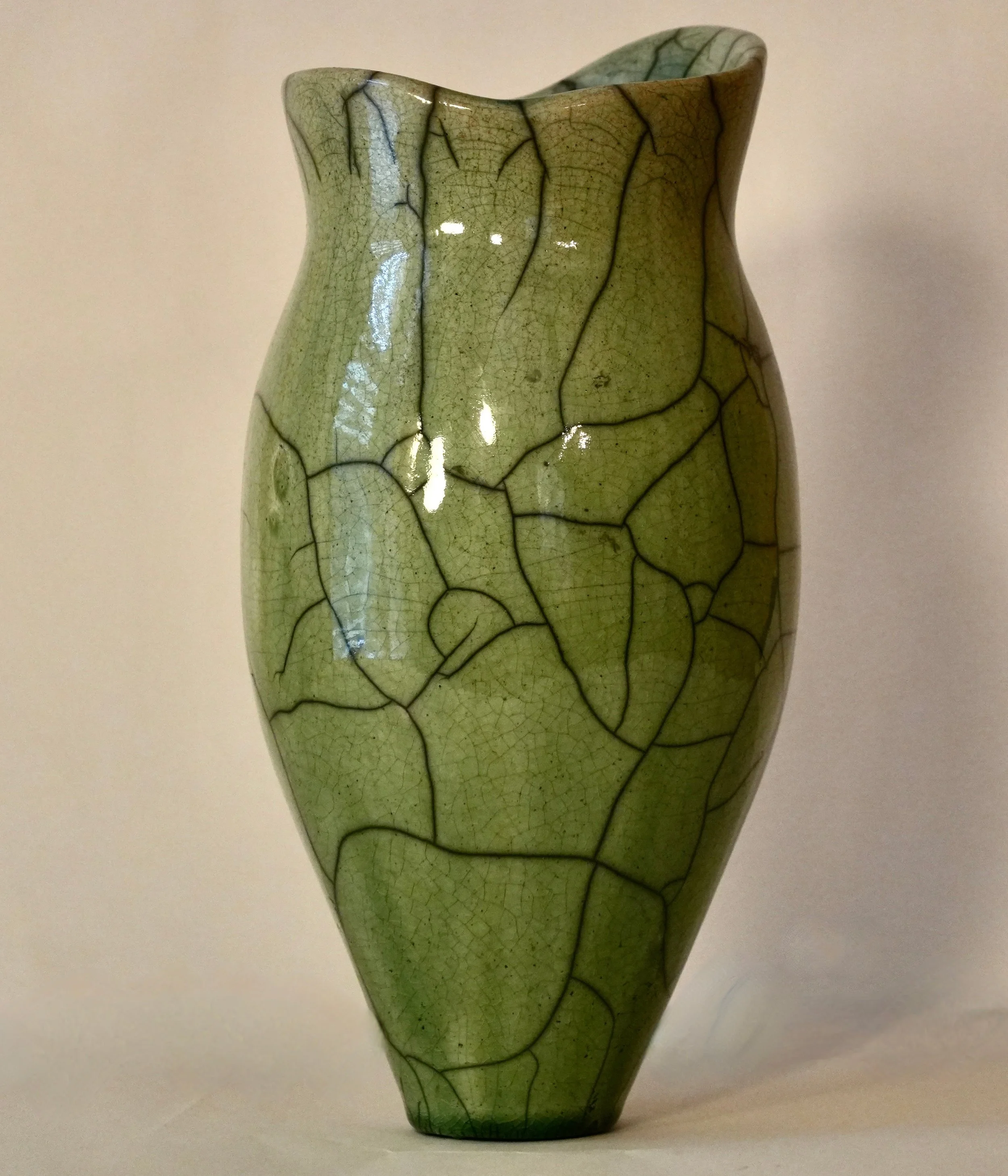 Green raku vessel with irregular rim