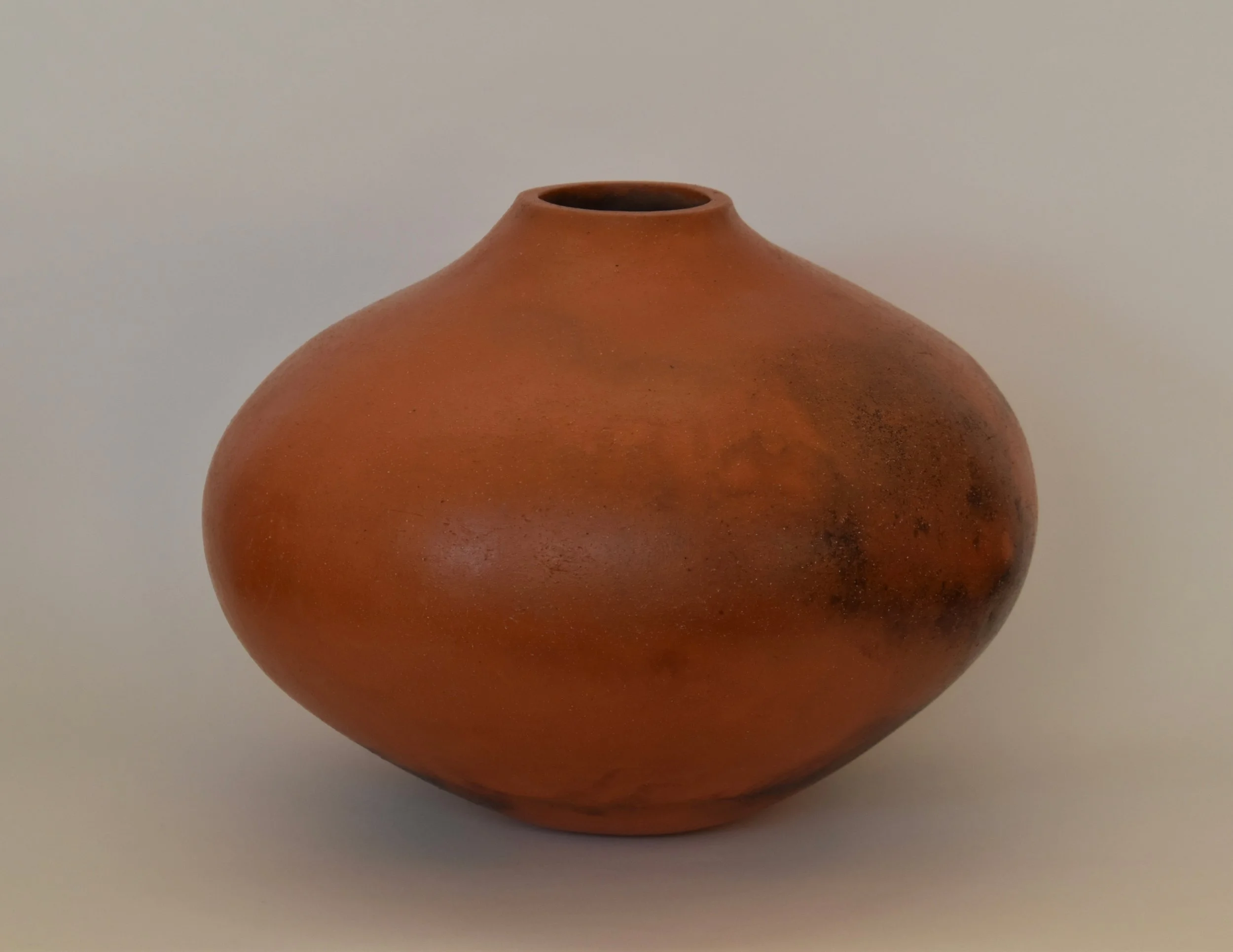 Smoke fired terra cotta vessel