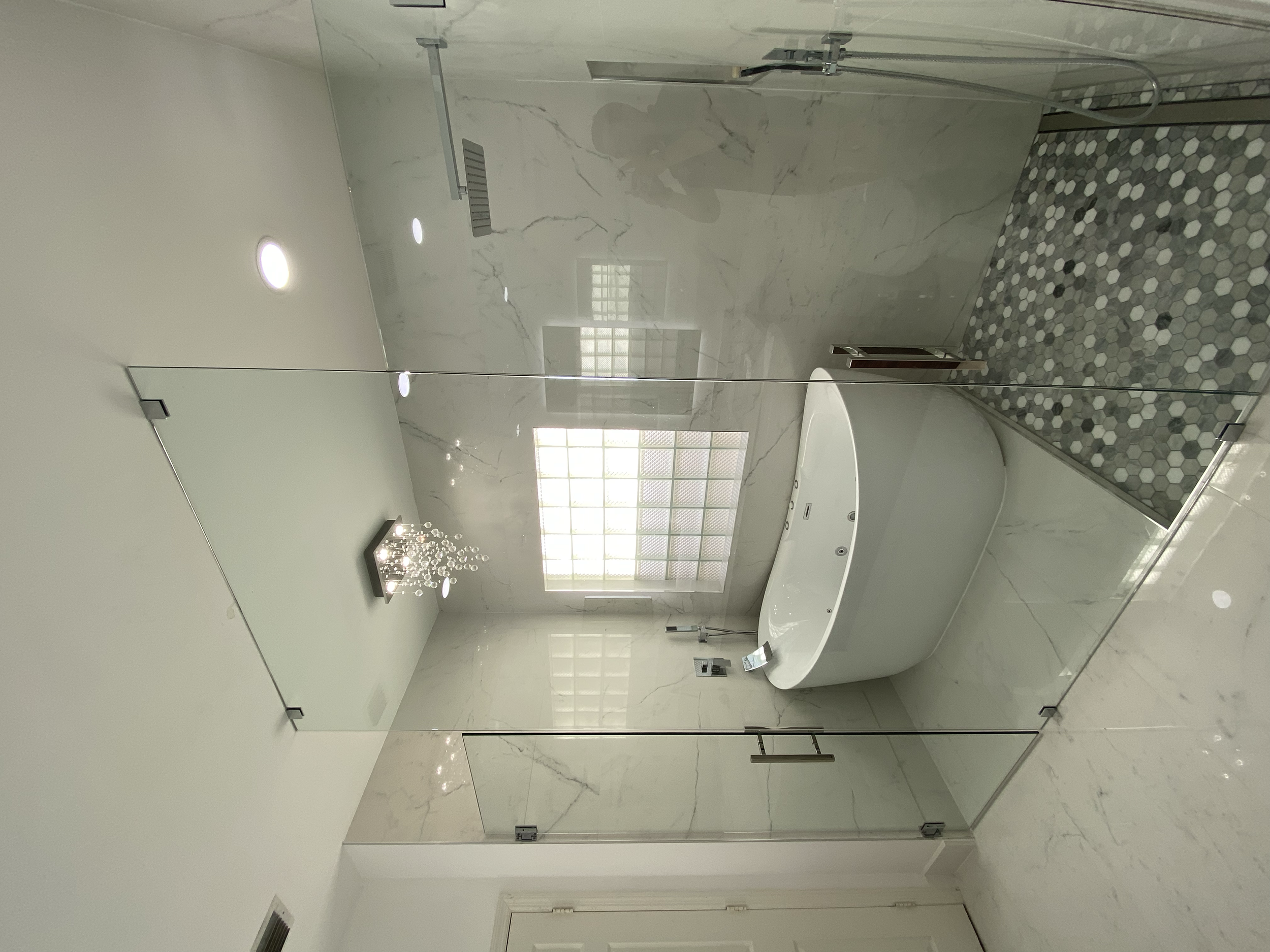 Floor to ceiling glass panel with two separate doors