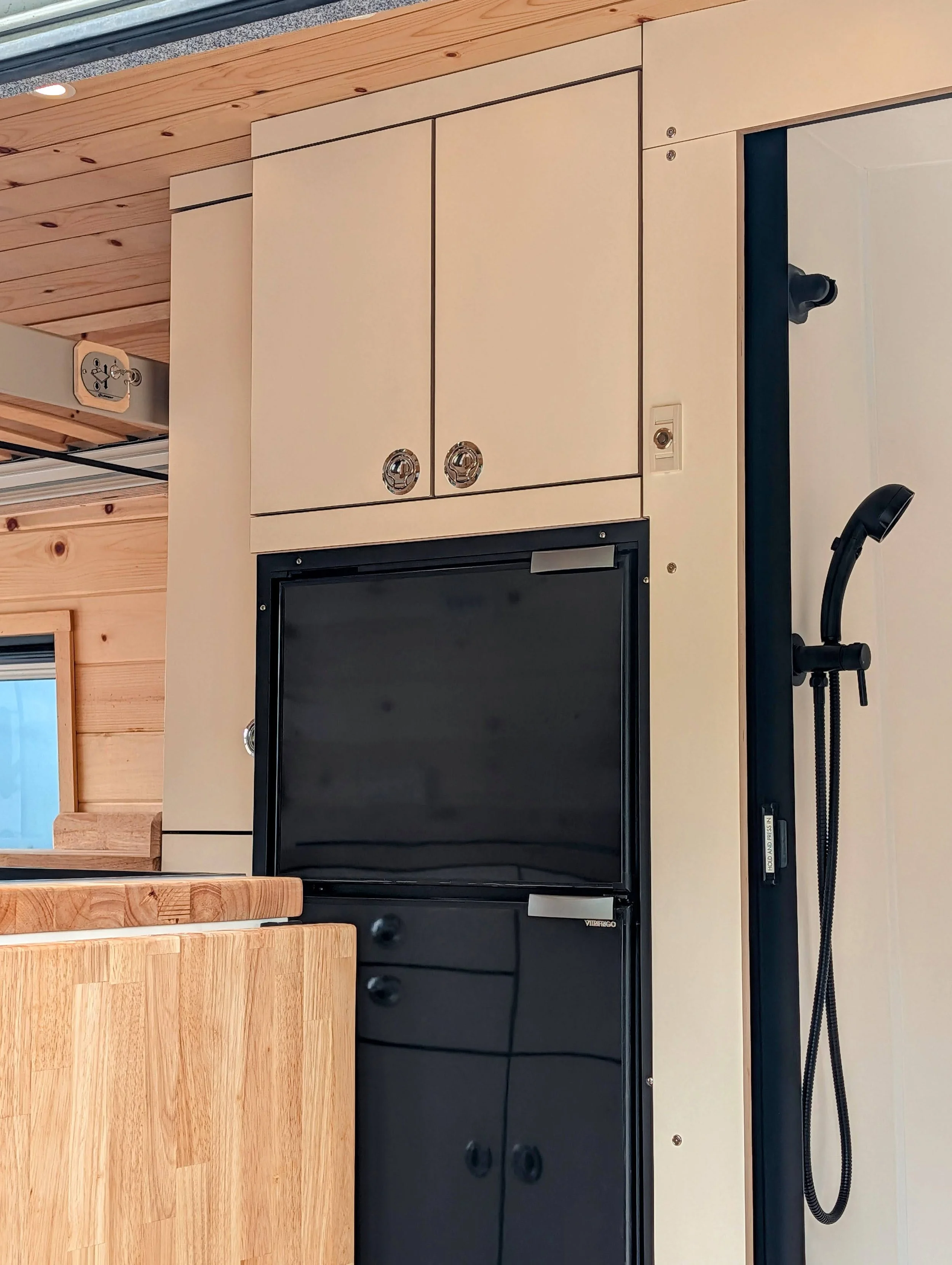 Custom Ford Transit Conversion, bed lift, custom cabinetry, Vitrifrigo Fridge