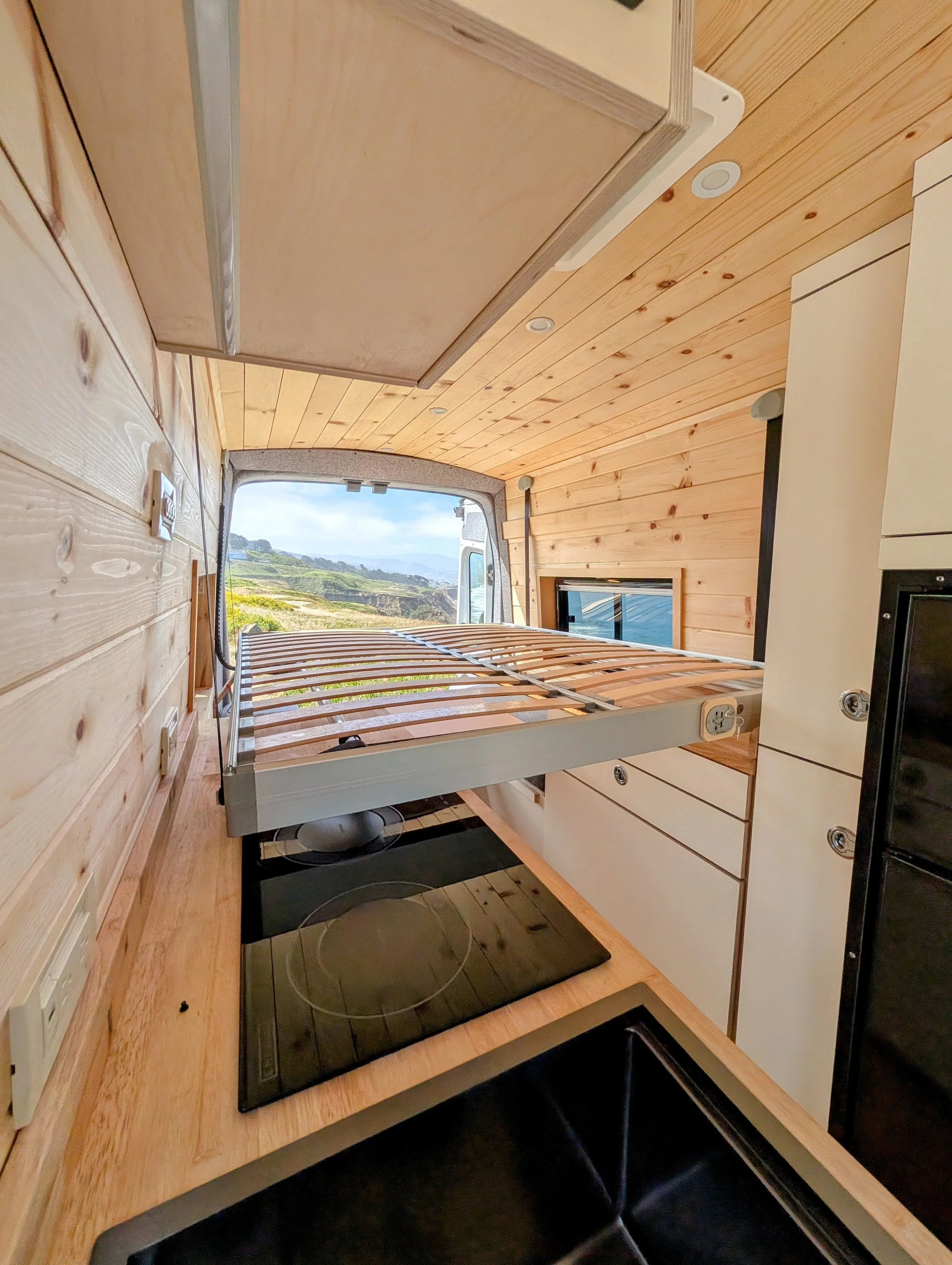 Custom Ford Transit Conversion, bed lift, custom cabinetry, Euroloft