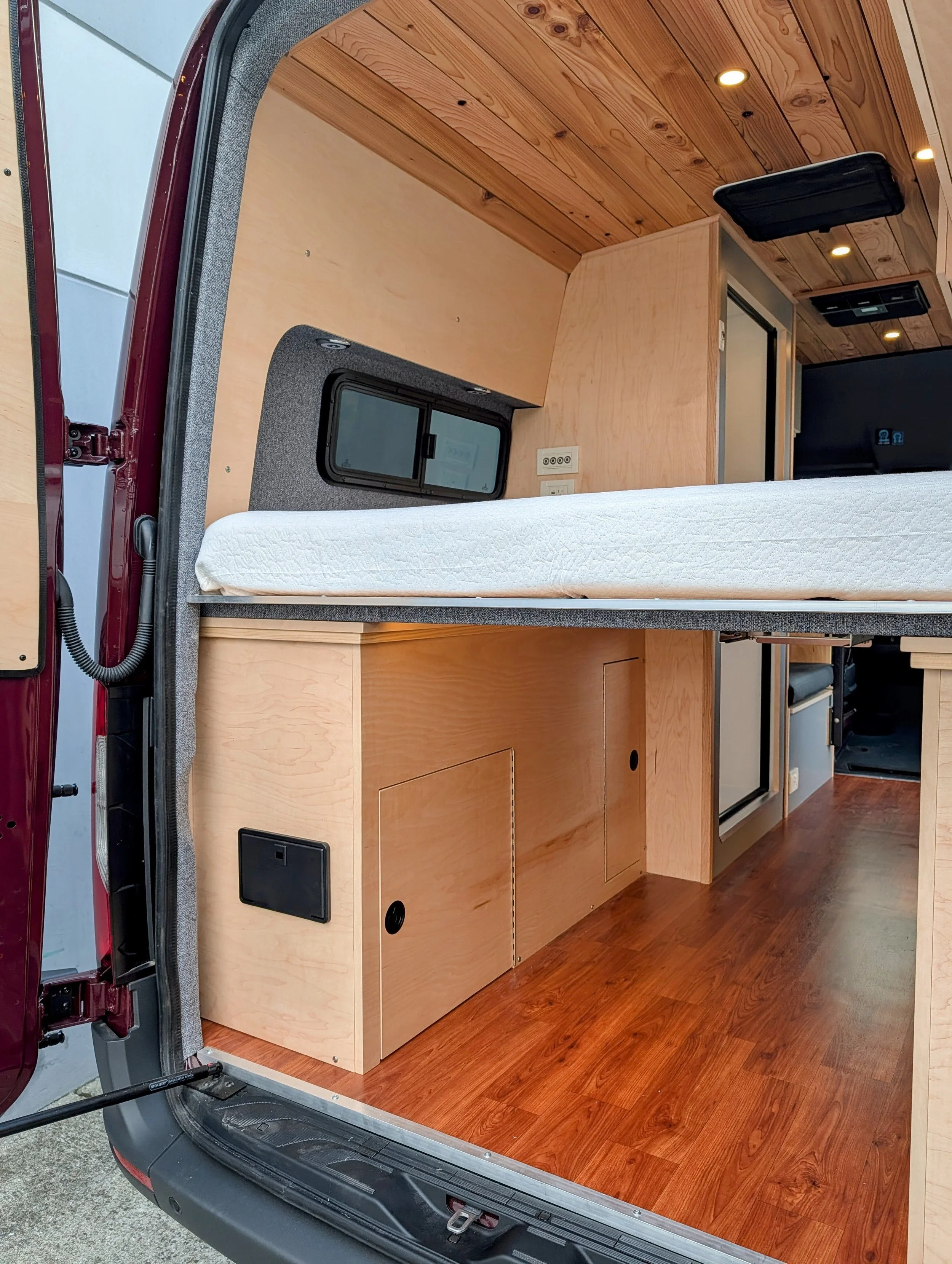 Custom Mercedes Sprinter Camper Van, bed, cabinetry