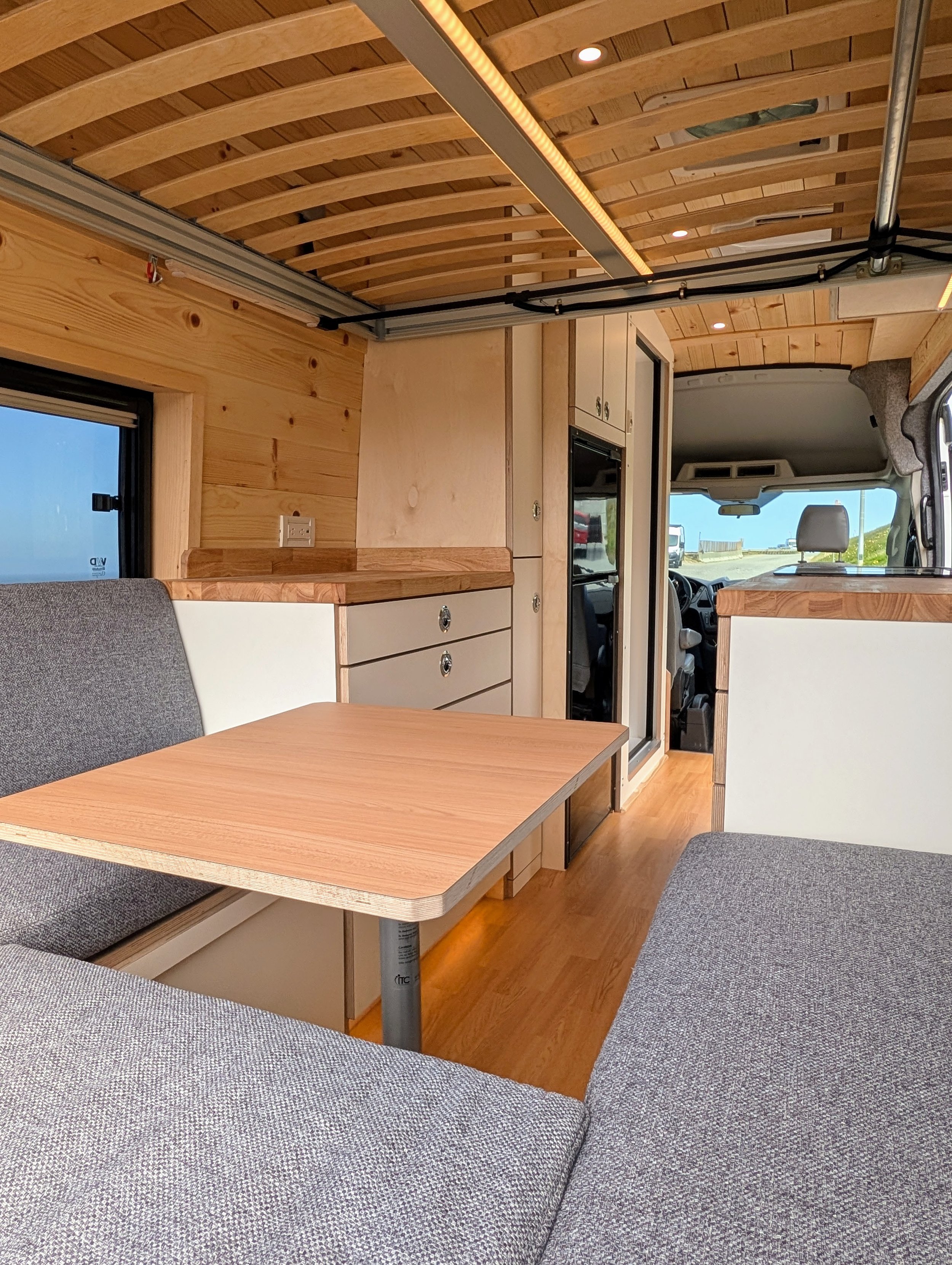 Custom Ford Transit Conversion, bed lift, custom cabinetry, Euroloft