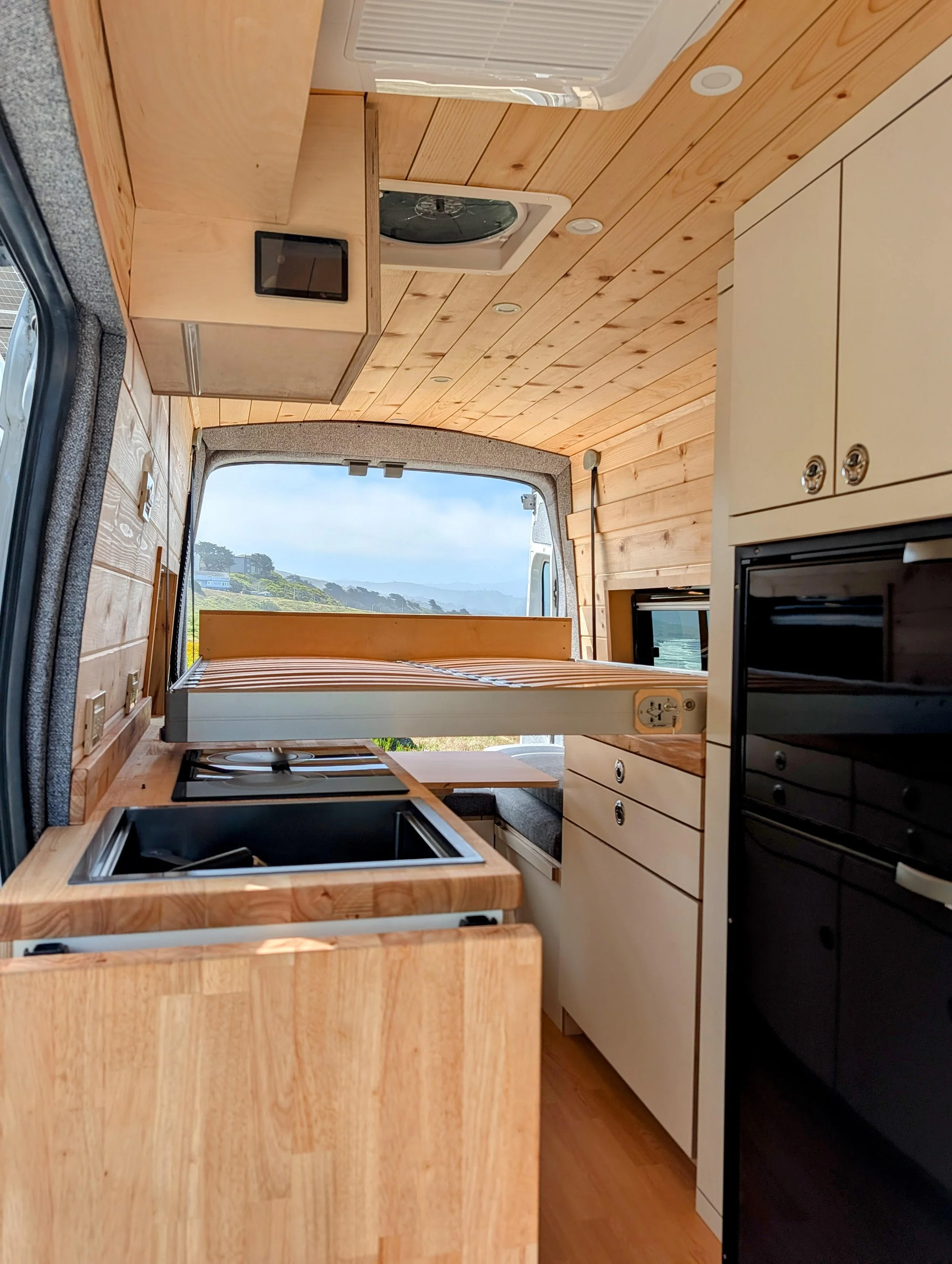 Custom Ford Transit Conversion, bed lift, custom cabinetry, Euroloft
