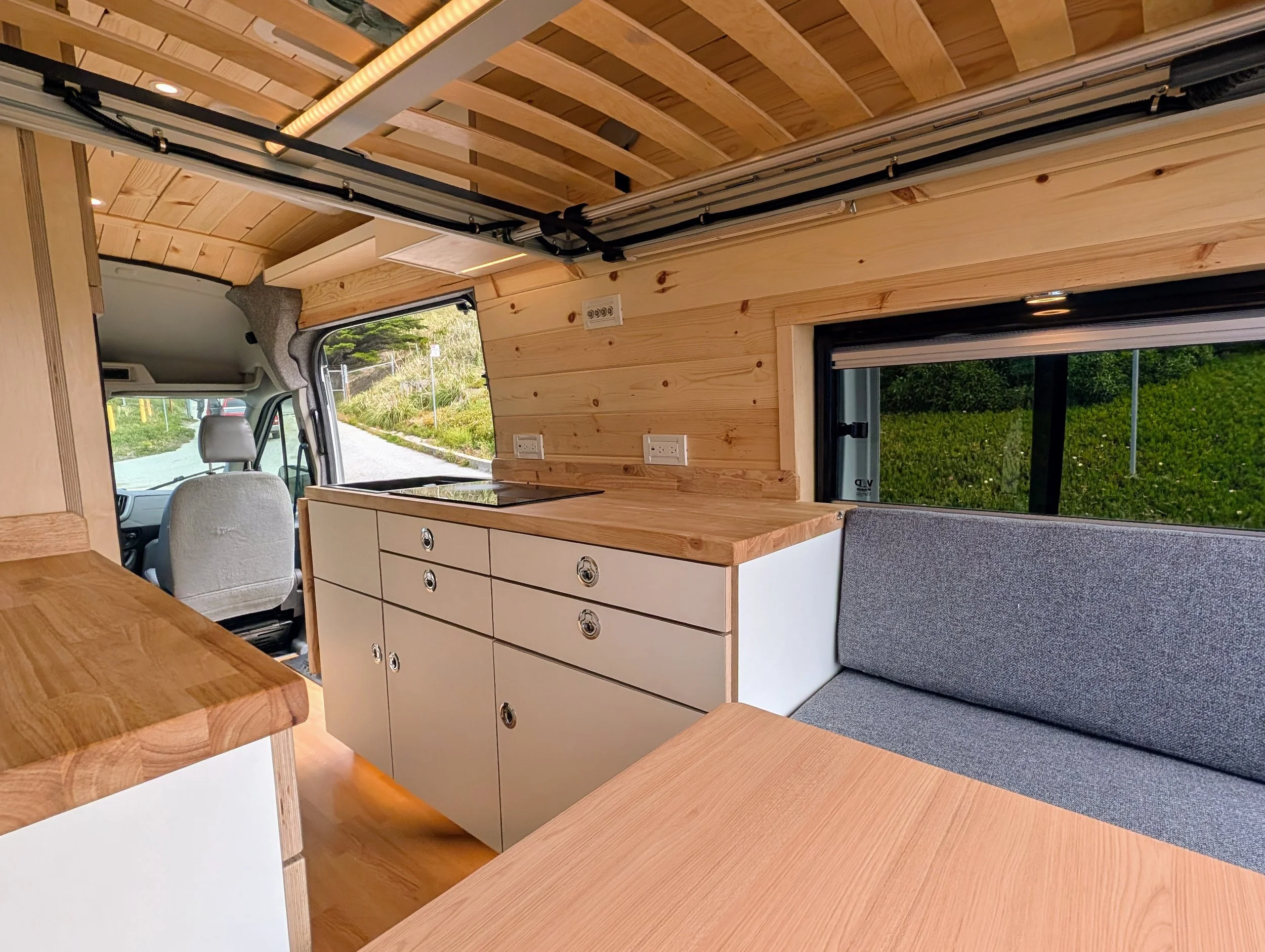 Custom Ford Transit Conversion, bed lift, custom cabinetry, Euroloft