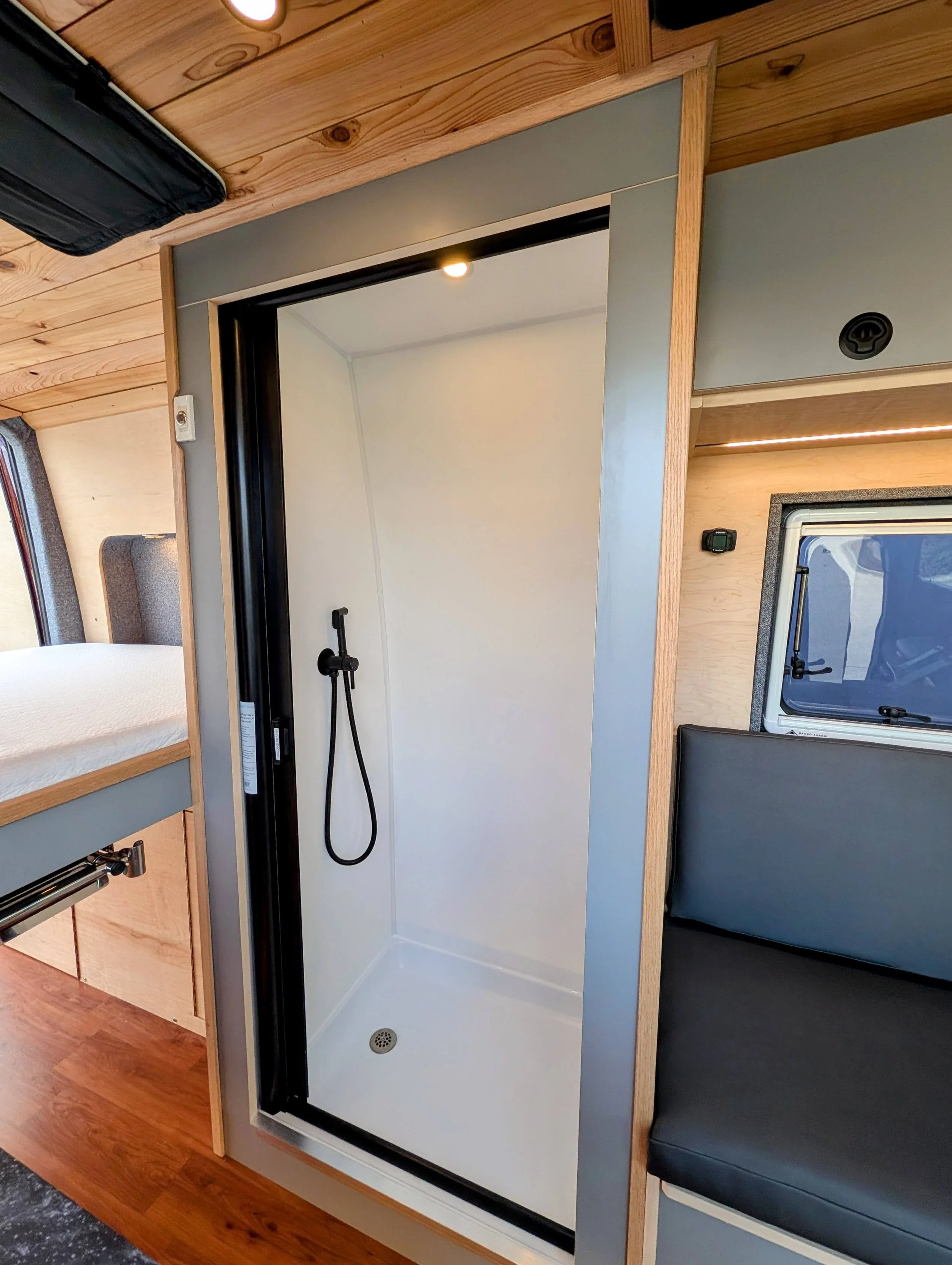 Custom Mercedes Sprinter Camper Van, full shower, custom shower, nautalus door 