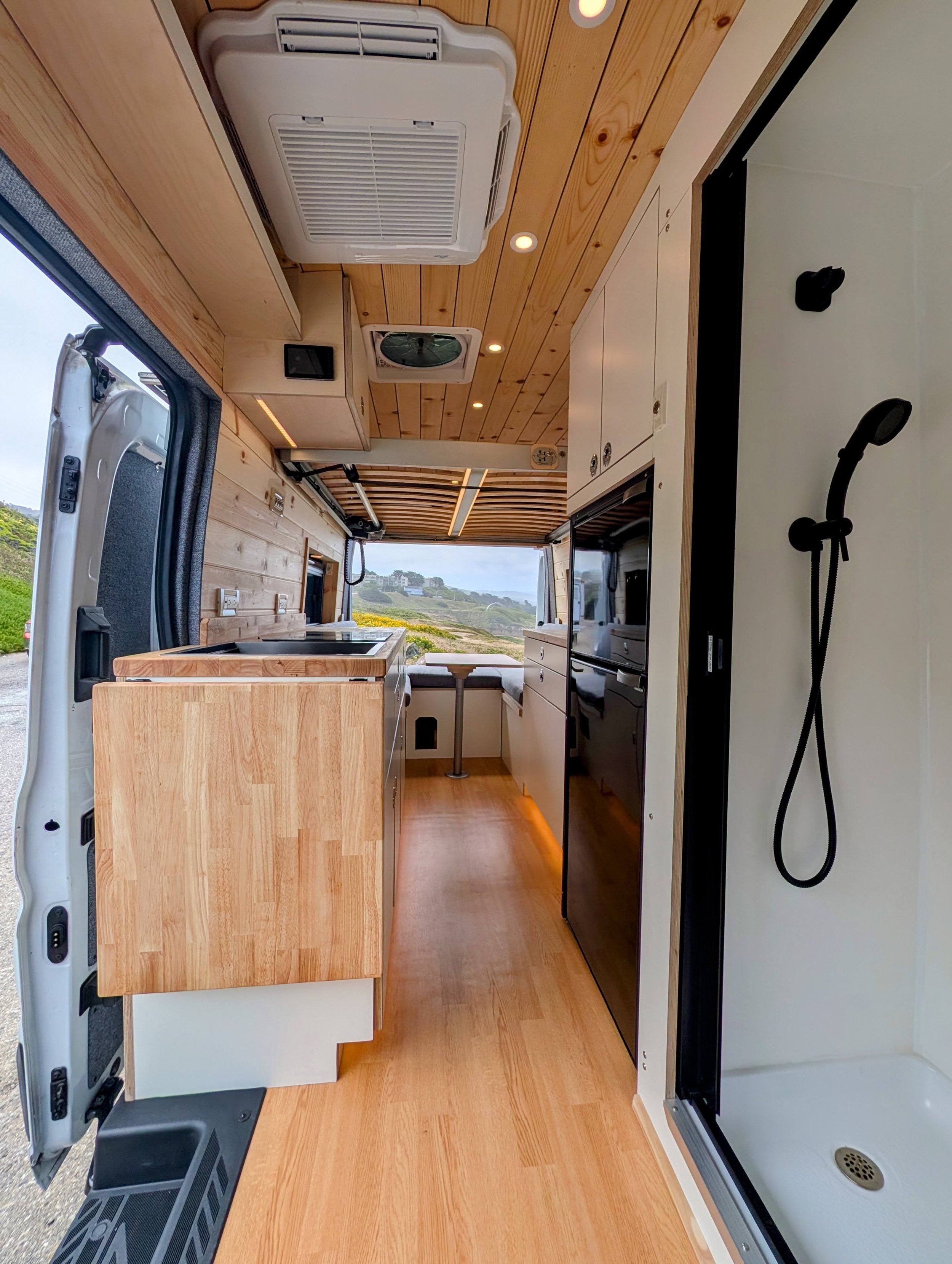 Custom Ford Transit Conversion, shower, custom cabinetry