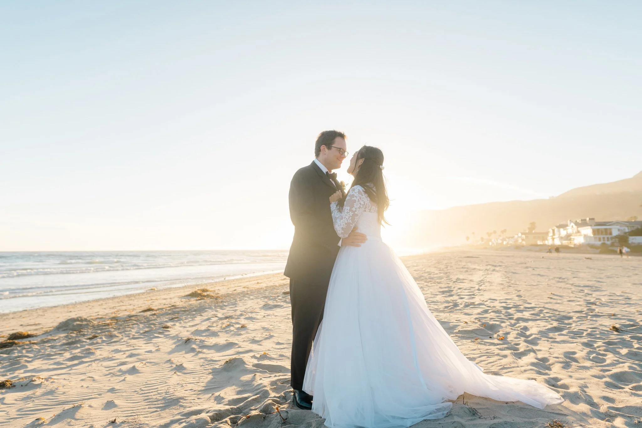 Wedding couple at sunset, Zuma Beach, Malibu