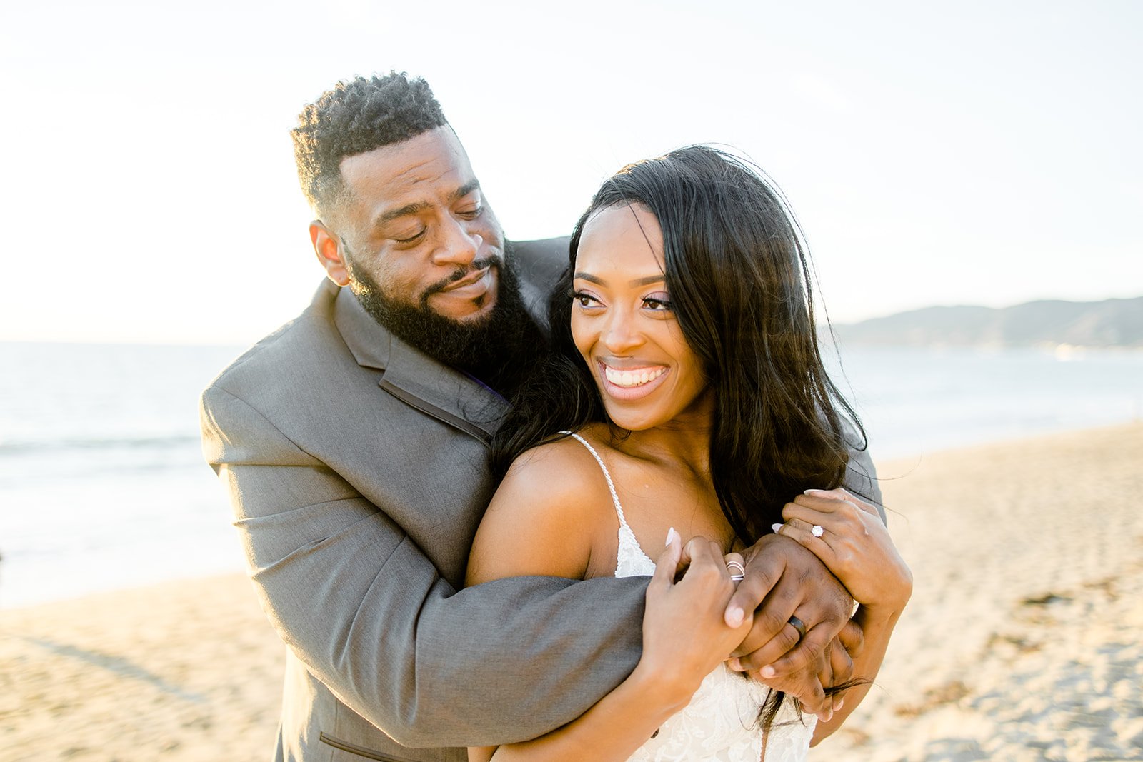 Elopement couple embrace at Point Dume, Malibu